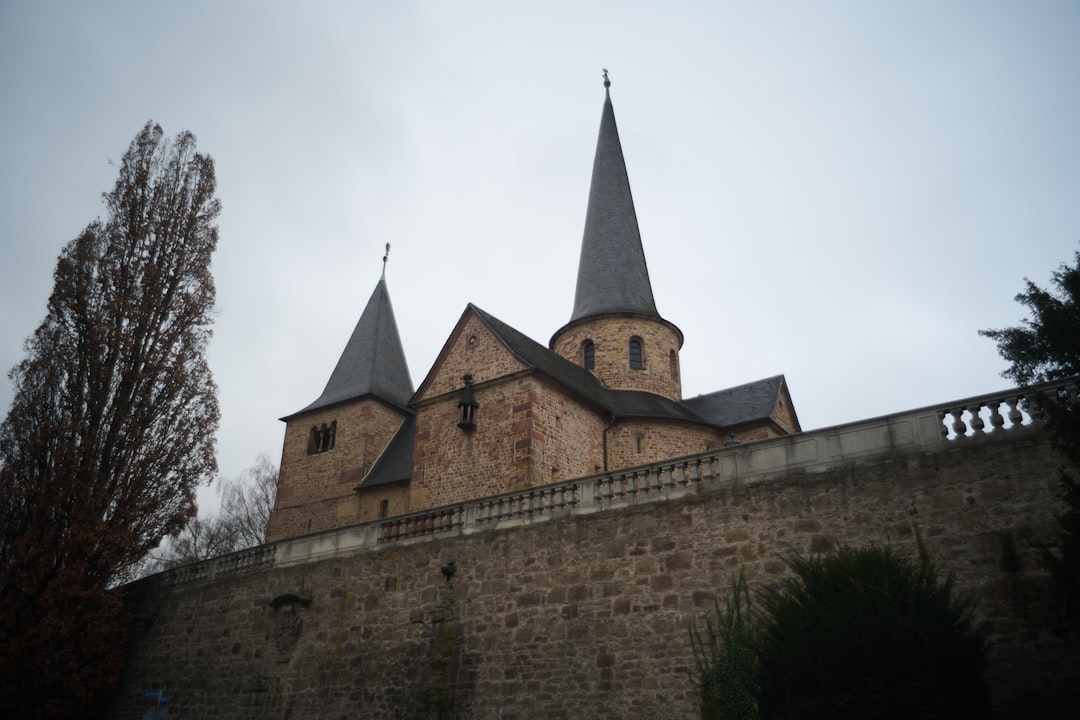 A large brick building with two towers on top of it